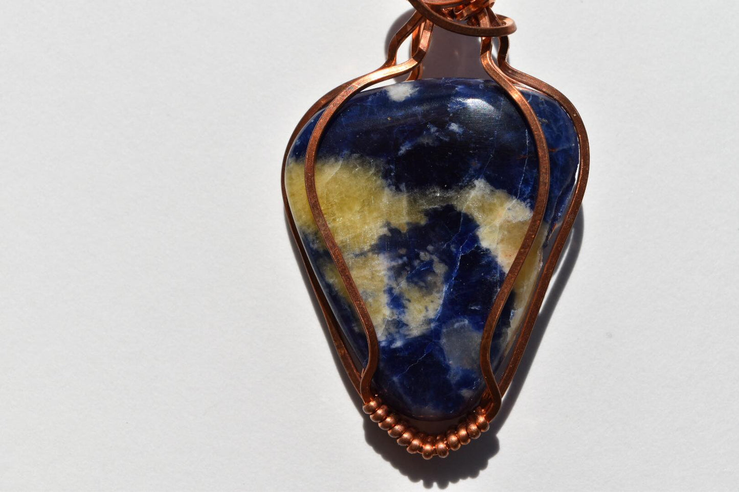 Sodalite Wrapped in Copper Wire Pendant