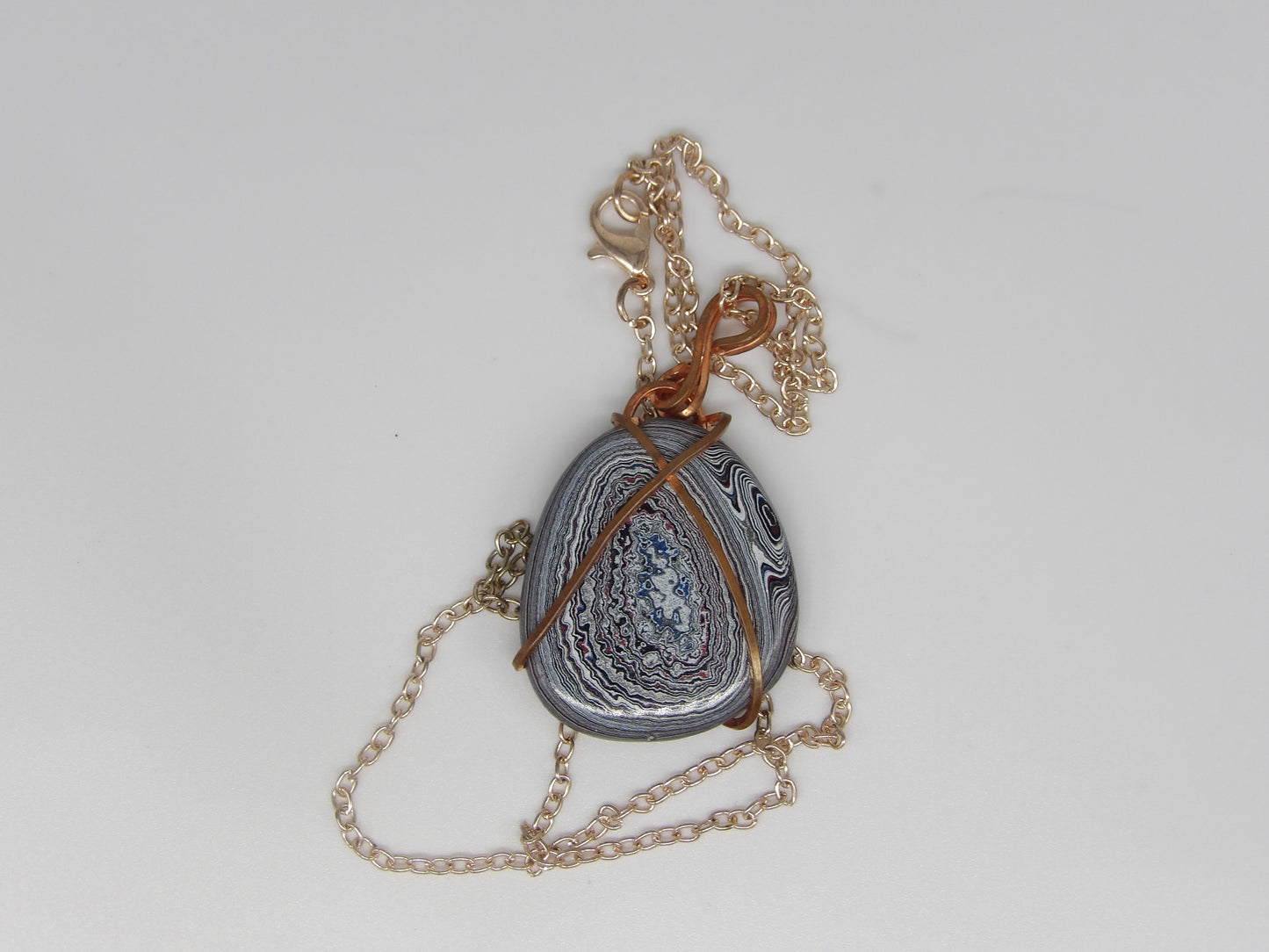 Fordite Wrapped in Copper Wire Pendant