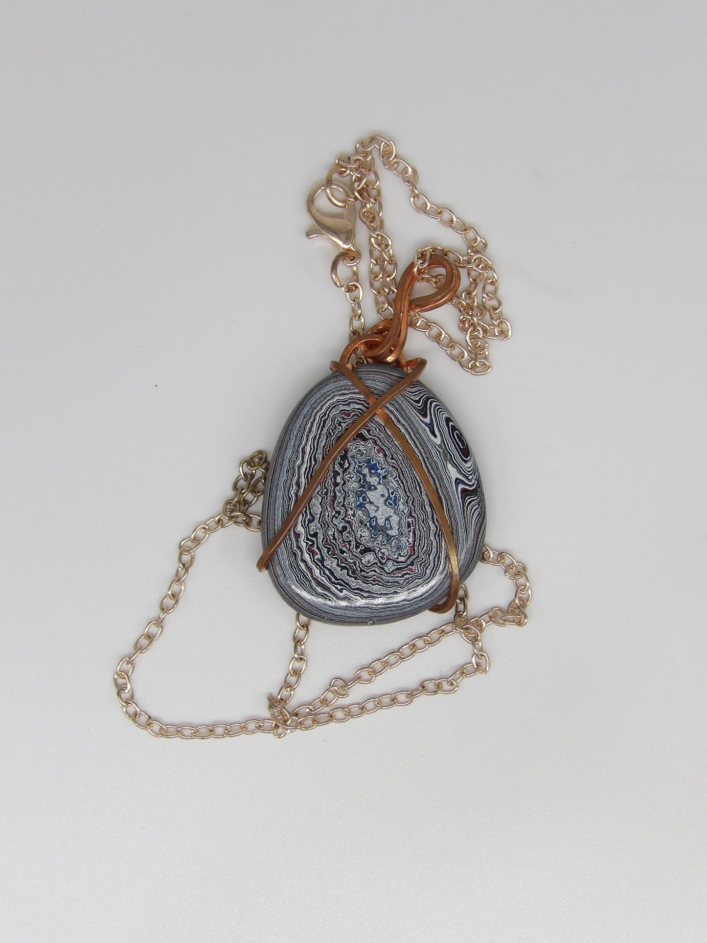 Fordite Wrapped in Copper Wire Pendant